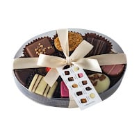 assorted belgian chocolates in 15cm cello oval with ribbon
