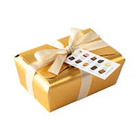 assorted belgian chocolates in gold ballotin with ribbon